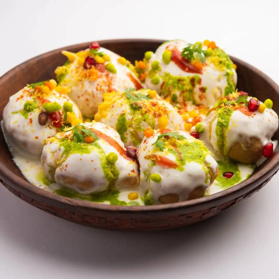 Dahi Vada Street Food Chaat with lentil dumplings soaked in yogurt and topped with chutneys
